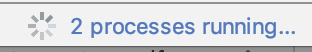 進行状況バーが回転し、「2 processes running...」というテキストが表示されている画像。