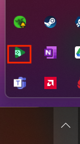 Uma captura de tela da barra de tarefas do Windows 11. A imagem de cenoura é selecionada para mostrar ícones ocultos, e um quadrado vermelho é exibido ao redor do 